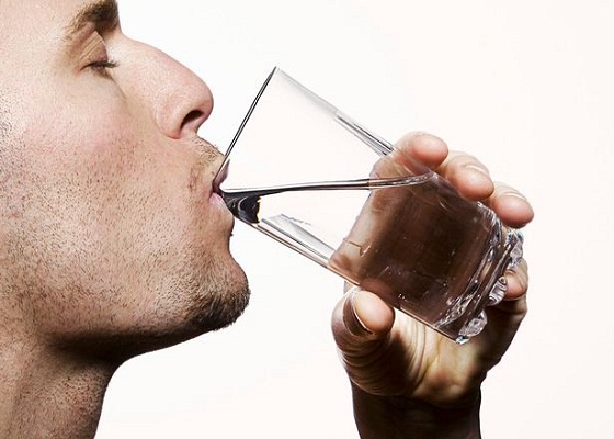 A man drinking water