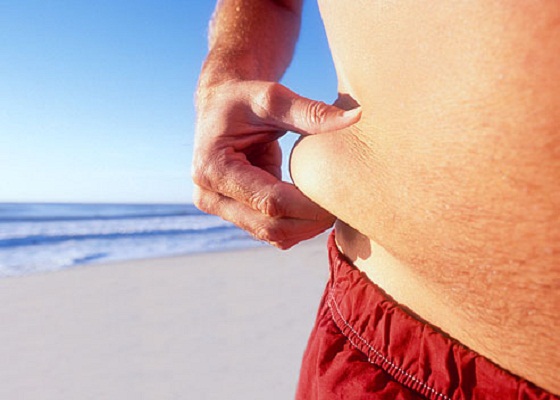 getty rm photo of man pinching fat